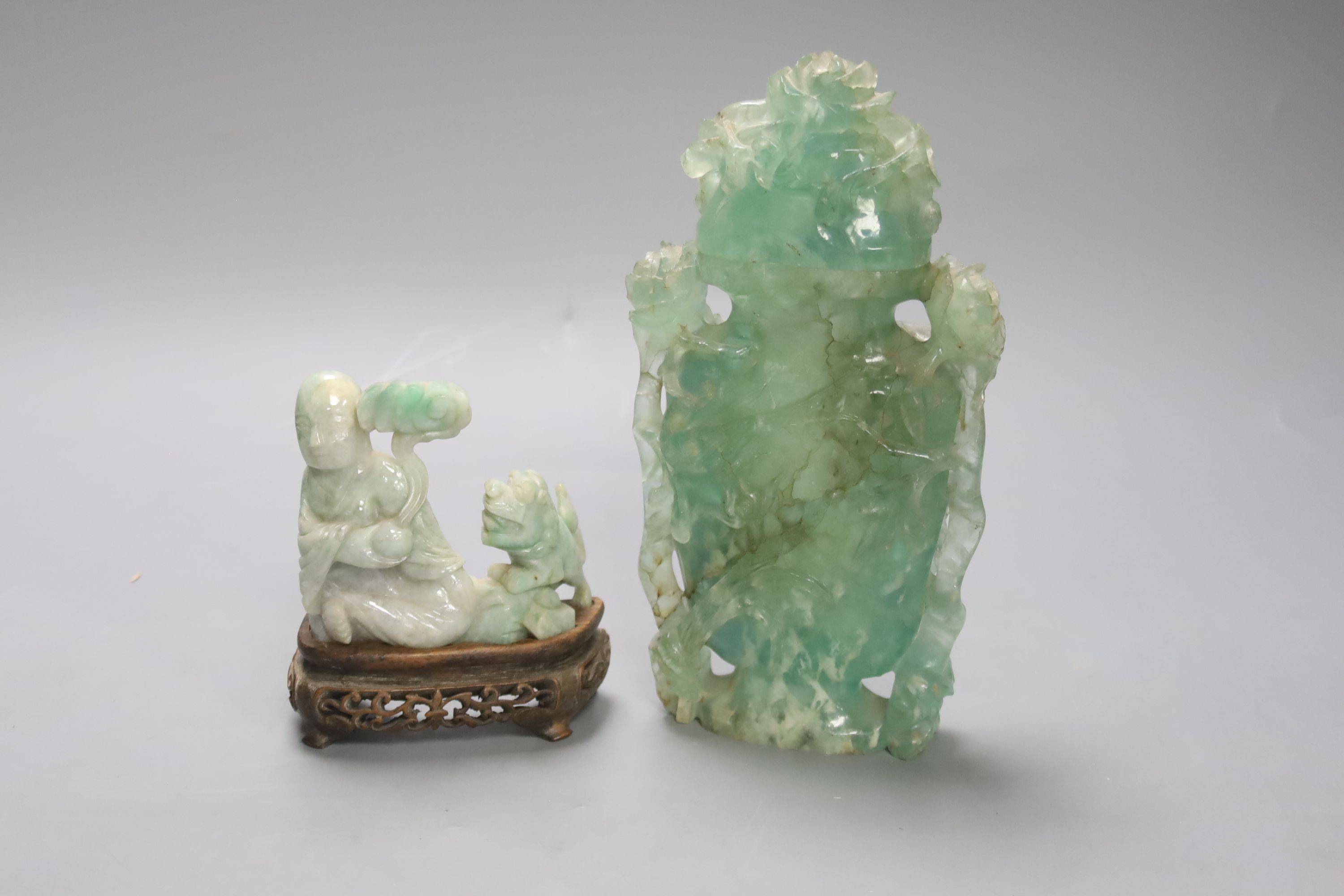 A Chinese jadeite carving of a Luohan and a green quartz vase and cover, 20cm (2)
